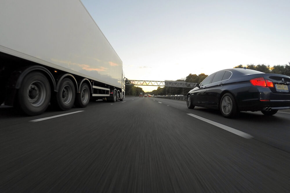 truckandcaronhighway01 | Limepack truck and car on highway